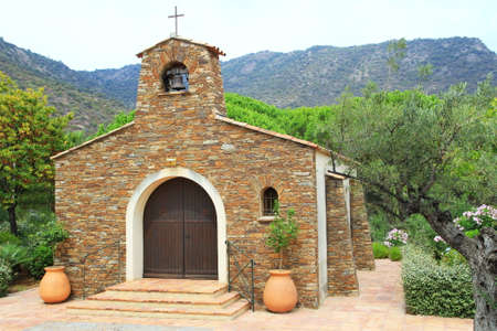 Quaint rustic stone Provencal chapel in france, with terracotta pots, among olive trees in Franceの写真素材