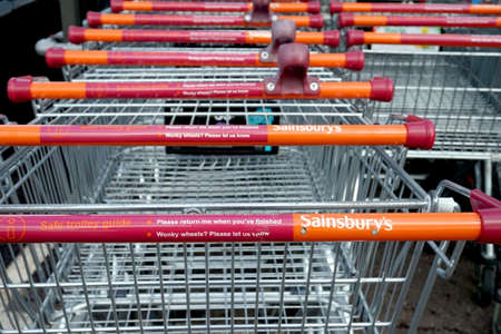 Basingstoke, Hampshire, UK - October 17 2016: Supermarket trolleys outside the Sainsburys superstore in Kempshott Park Basingstokeのeditorial素材