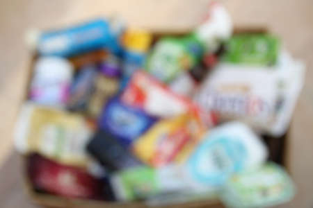 Blurred background of a domestic recycling box with waste from major UK brandsの写真素材