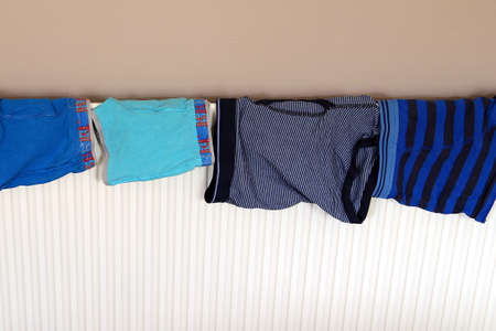 Underwear drying on a domestic radiator after being washed