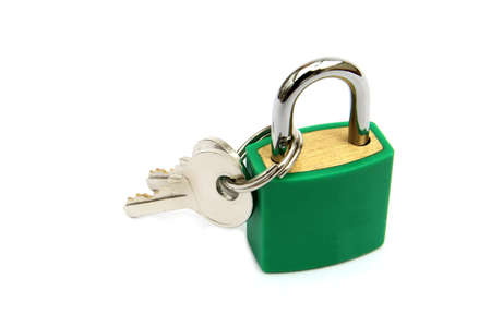 Green padlock, locked, with two keys on white backgroundの写真素材