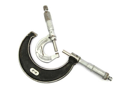 Two vintage imperial micrometers, on white backgroundの写真素材