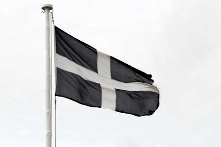 Cornish independence flag flying against a white skyの写真素材