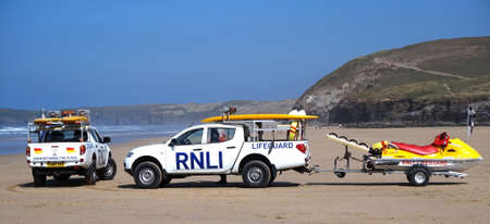 Newquay, Cornwall, UK - April 7 2017: RNLI Lifeguard trucks and jetski on a Cornish surfing beach at Newquayのeditorial素材