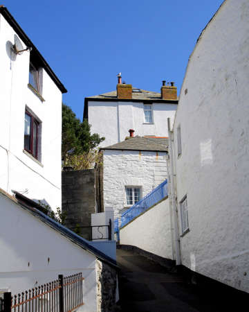 Quiet deserted narrow street in a picturesque fishing village in Englandの写真素材