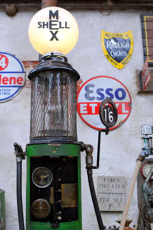 Beaulieu, Hampshire, UK - May 29 2017: Very old 20th Century Shell Mex petrol pump and contemporary signsのeditorial素材