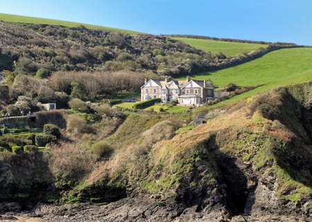 Port Isaac, Cornwall, UK - April 8th 2017: View across the harbour to a large private residenceのeditorial素材