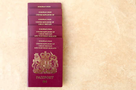 Neat pile of five British United Kingdom European Union Biometric passports with copyspace for textの写真素材