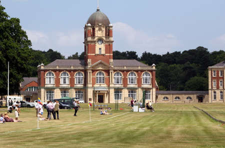 Sandhurst, Surrey, UK - June 18th 2017: Visitors to the Royal Military Academy Sandhurst waiting for the polo to start, in front of the New College Clocktowerのeditorial素材