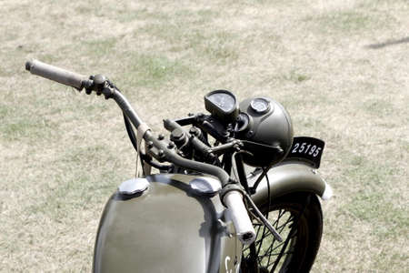 Sandhurst, UK - 18th June 2017: Vintage toned shot of a WW2 motorcycle handlebarsのeditorial素材