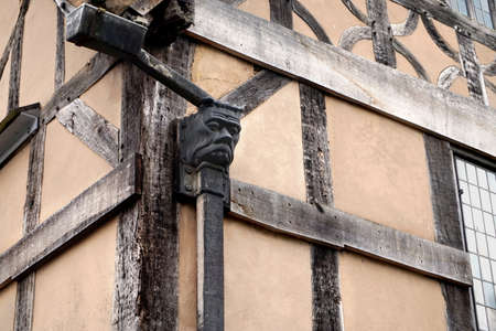 Traditional gargoyle style rainwater gully on a tudor timber framed wattle and daub buildingの写真素材