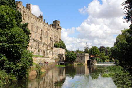 Warwick, UK - July 22 2017: Warwick Castle, mill and weir on the River Avonのeditorial素材