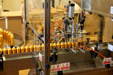 Grasse, France - August 27 2012: Perfume bottling machine at the Fragonard Perfume factoryのeditorial素材