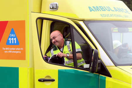 Beaulieu, Hampshire, UK - May 29 2017: Driver getting out of an ambulance belonging to the Educational Unit after arriving at an incidentのeditorial素材