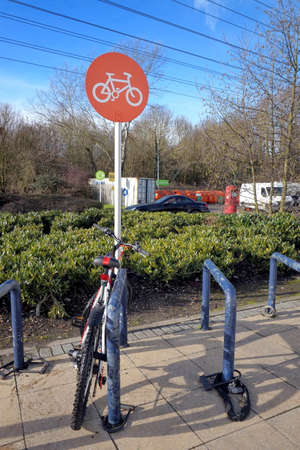 Camberley, UK - February 2 2017: Bicycle parked in a dedicated cycle park at a supermarketのeditorial素材