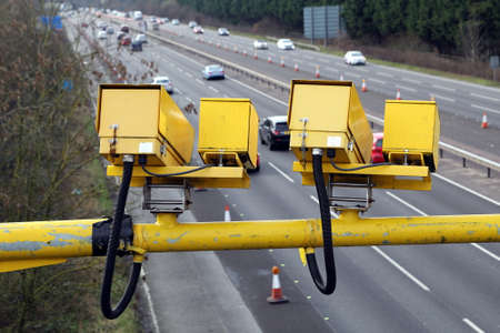Fleet, Hampshire, UK - March 11th 2017: Average speed cameras in operation on the M3 Motorway to reduce vehicle speed to safe limits in roadworksのeditorial素材