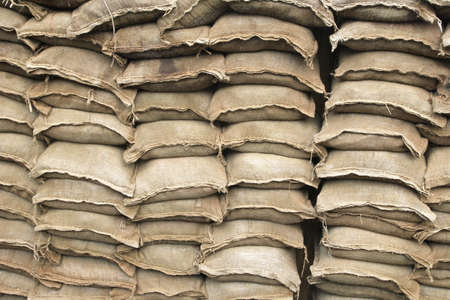 Pile of sand bags used in trench warfare or as a flood defence.の写真素材