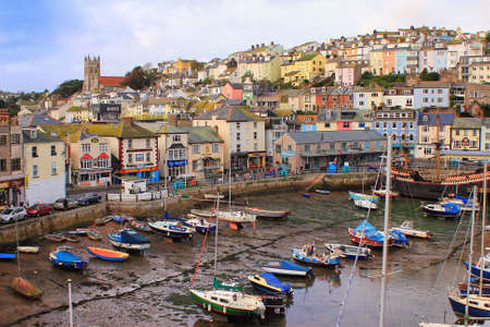 BRIXHAM, DEVON, UK, NOV 02 2015: Small boats moored at low tide in the fishing portのeditorial素材