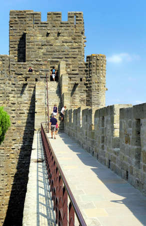Carcassonne, Languedoc-Roussillon, France - August 24 2017: Visitors on the battlements tour at the medieval French fortified city of Carcassonne, La Cite, Languedoc-Roussillon, Franceのeditorial素材