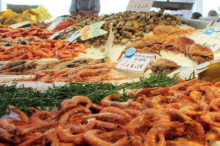 Valras-Plage, Herault, France - Aug 25 2017: Selection of raw and cooked shrimp, prawn and crab for sale in a French seafood storeのeditorial素材