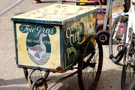 Pezenas, Herault, France - Aug 26 2017: Old-fashioned vintage reto styled hand cart selling Pate Fois Gras, belonging to "Cremerie Clerc" of Pezenas, Languedoc, Herault, Franceのeditorial素材