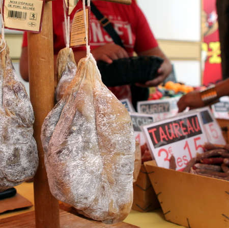 Valras-Plage, Herault, France - Aug 25 2017: Dried pork shoulder (noix d'Ã©paule de porc sechee)for sale at a French marketのeditorial素材