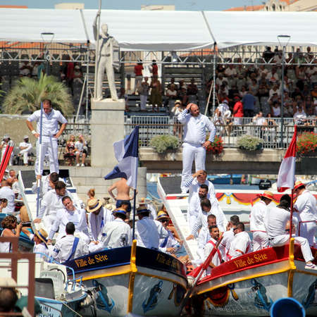 Sete, Herault, France  - Aug 21 2017: Traditional French Water Jousters preparing to compete at the 2017 Festival of Saint-Louis in Sete, Herault, Languedoc, Franceのeditorial素材