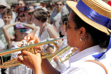 Sete, Herault, France  - Aug 21 2017: Brass player in the traditional French band "Los Marineros" marching at the 2017 Festival of Saint-Louis in Sete, Herault, Languedoc, Franceのeditorial素材