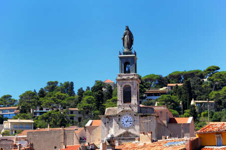 Sete, Herault, France  - Aug 21 2017: Statue on top of the clock tower of the Church of Saint-Louis in the town of Sete, in the Herault region of Franceのeditorial素材