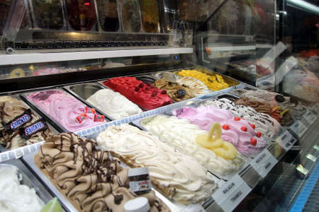 Cap D'Agde, Herault, France - August 30 2017: Tubs of ice cream at an icecream parlour, featuring Nutella and Snickers flavoursのeditorial素材