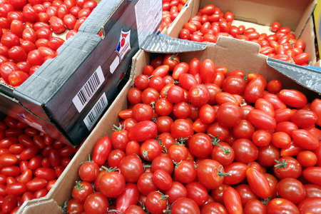 Serignan, France - August 20 2017: Boxes of plum tomatoes for sale in a French supermarketのeditorial素材