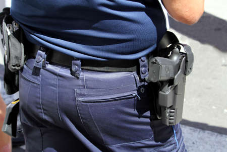 Sete, Herault, France  - Aug 21 2017: Close up of the hand gun worn in a holster by a French Police...