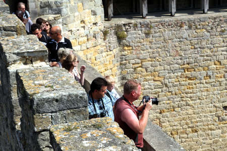 Carcassonne, Languedoc-Roussillon, France - August 24 2017: Visitors on the battlements tour at the medieval French fortified city of Carcassonne, La Cite, Languedoc-Roussillon, Franceのeditorial素材