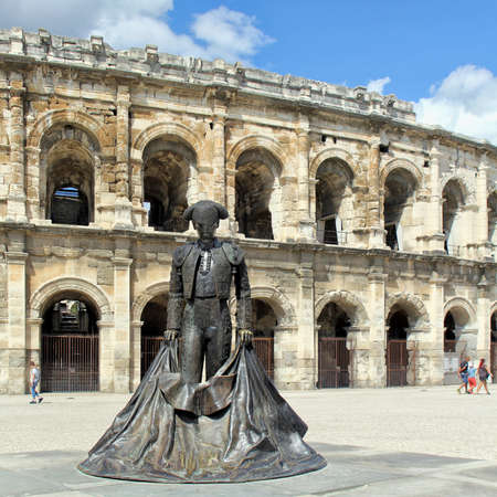 Nimes, Gard, France - Sep 02 2017: The statue of the matador Christian Montcouquiol ("NimeÃ±o II") in front of the Arena of Nimes, a Roman amphitheater built in 70 AD.のeditorial素材
