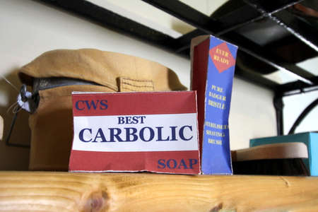 Falmouth, Cornwall, UK - April 12 2018:An antique box of Carbolic Soap, with a shaving brush,...