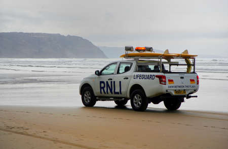 Newquay, Cornwall, UK - May 09 2018: RNLI Lifeguard truck on a Cornish surfing beach at Newquay.のeditorial素材