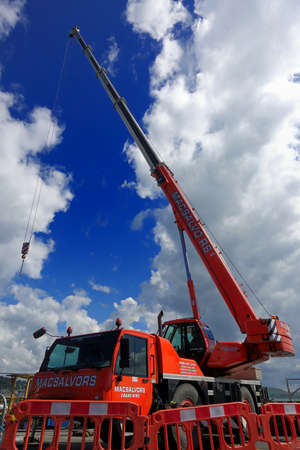 Padstow, Cornwall, April 11th 2018: Orange Terex AC 40/2L extending crane belonging to MacSalvors...