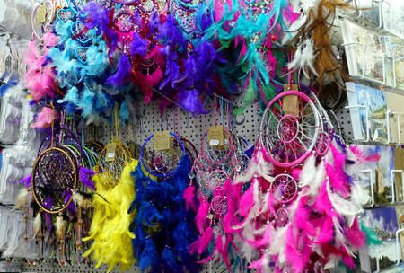 Padstow, Cornwall, April 11th 2018: Selection of multi colored feather dream catchers for sale in a souvenir shopのeditorial素材