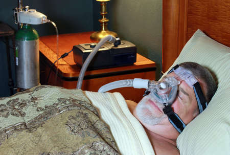 Adult Man sleeping Peacefully with CPAP and Oxygen