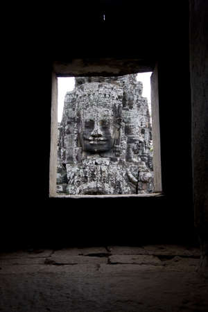 A stone faced carving in the Bayon Temple in Angkor Wat, Cambodiaの写真素材