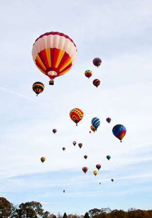 Hot Air Balloons fill the sky as they race to inflate then fly to the designated spot. Carolina Balloon Festival, Statesville, North Carolina.のeditorial素材