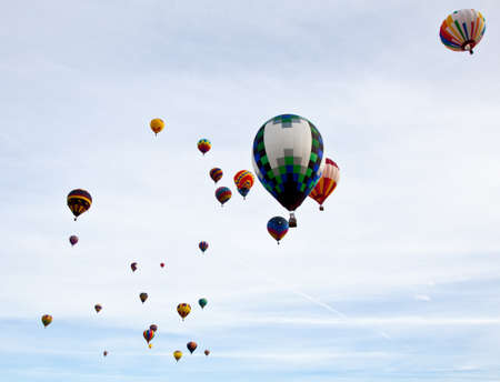Hot Air Balloons fill the sky as they race to inflate then fly to the designated spot. Carolina Balloon Festival, Statesville, North Carolina.のeditorial素材