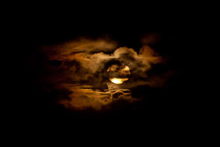 A full moon rises over the Pacific Ocean off the coast of Oahu, Hawaii