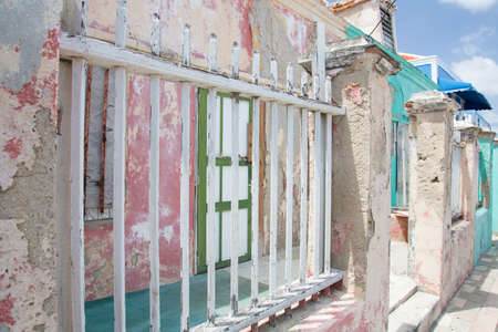 Houses that have fallen into disrepair on the weather beaten island of Curacao.の写真素材