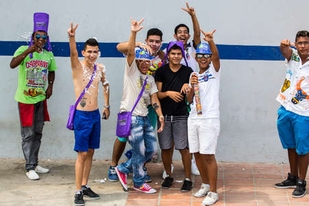 Barranquilla, Colombia - March 1, 2014 - Families and friends battle with white foam in the stands of the Barranquilla Carnival. The foam is basically soap and water sprayed from an arosol can.のeditorial素材