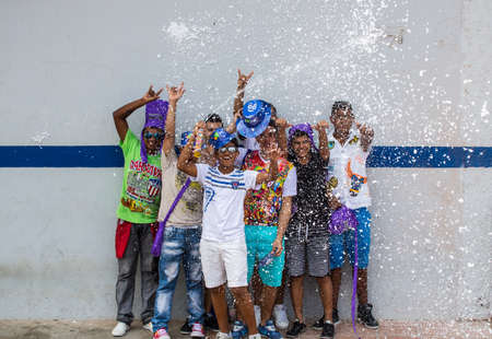 Barranquilla, Colombia - March 1, 2014 - Families and friends battle with white foam in the stands...
