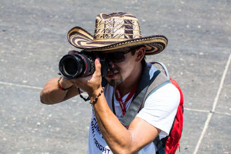 Barranquilla, Colombia - March 1, 2014 - A photographer records the spectacle at the Battalla de Flores, the pinnacle parade of Carnival de Barranquilla.のeditorial素材