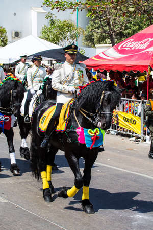 Barranquilla, Colombia - March 1, 2014- Mounted police ride the parade during the Battalla de Flores. Carnival de Barranquillaのeditorial素材