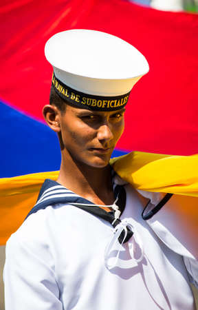 Barranquilla, Colombia - March 1, 2014 - A Colombian naval cadet carries the flag to start the Battala de Flores during Carnival de Barranquilla.のeditorial素材