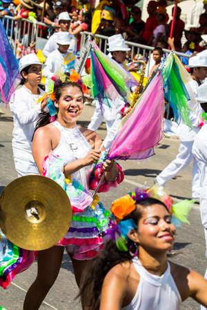Barranquilla, Colombia - March 1, 2014 - Performers in elaborate costume sing, dance, and stroll their way down the streets of Barranquilla during the Battalla de Flores during Carnivalのeditorial素材